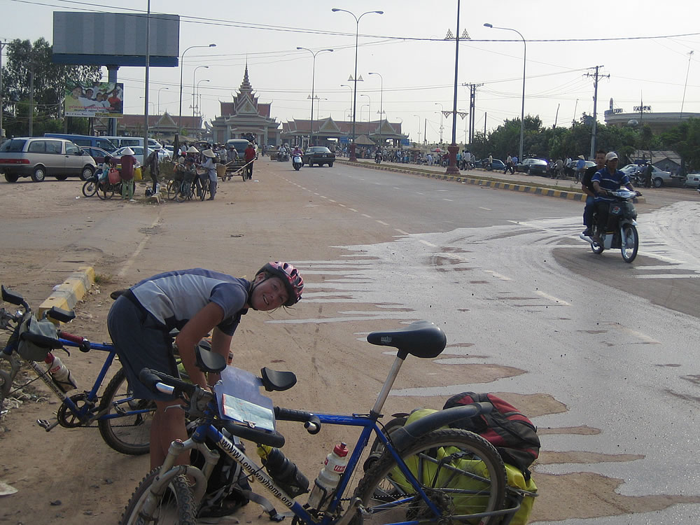 Crossing from Vietnam into Cambodia (border crossing in background)