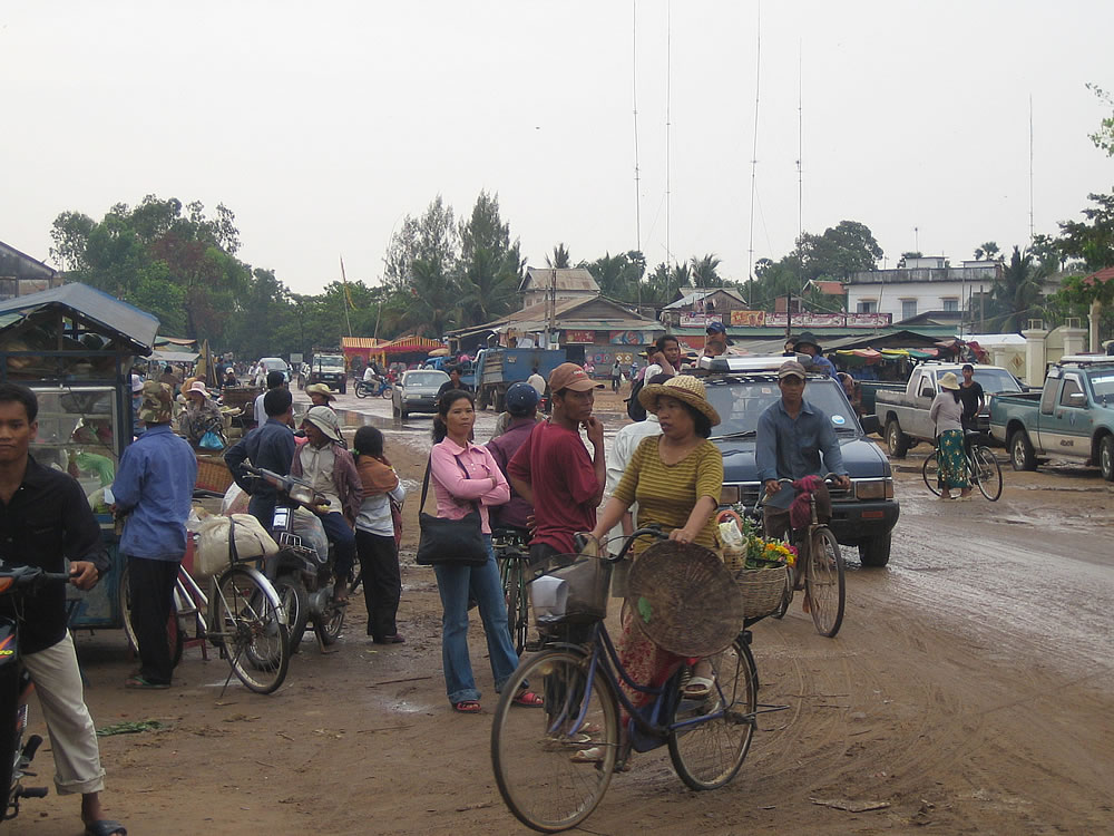 Busy street scene in one of the many small towns along the main highway west of Siem Reap